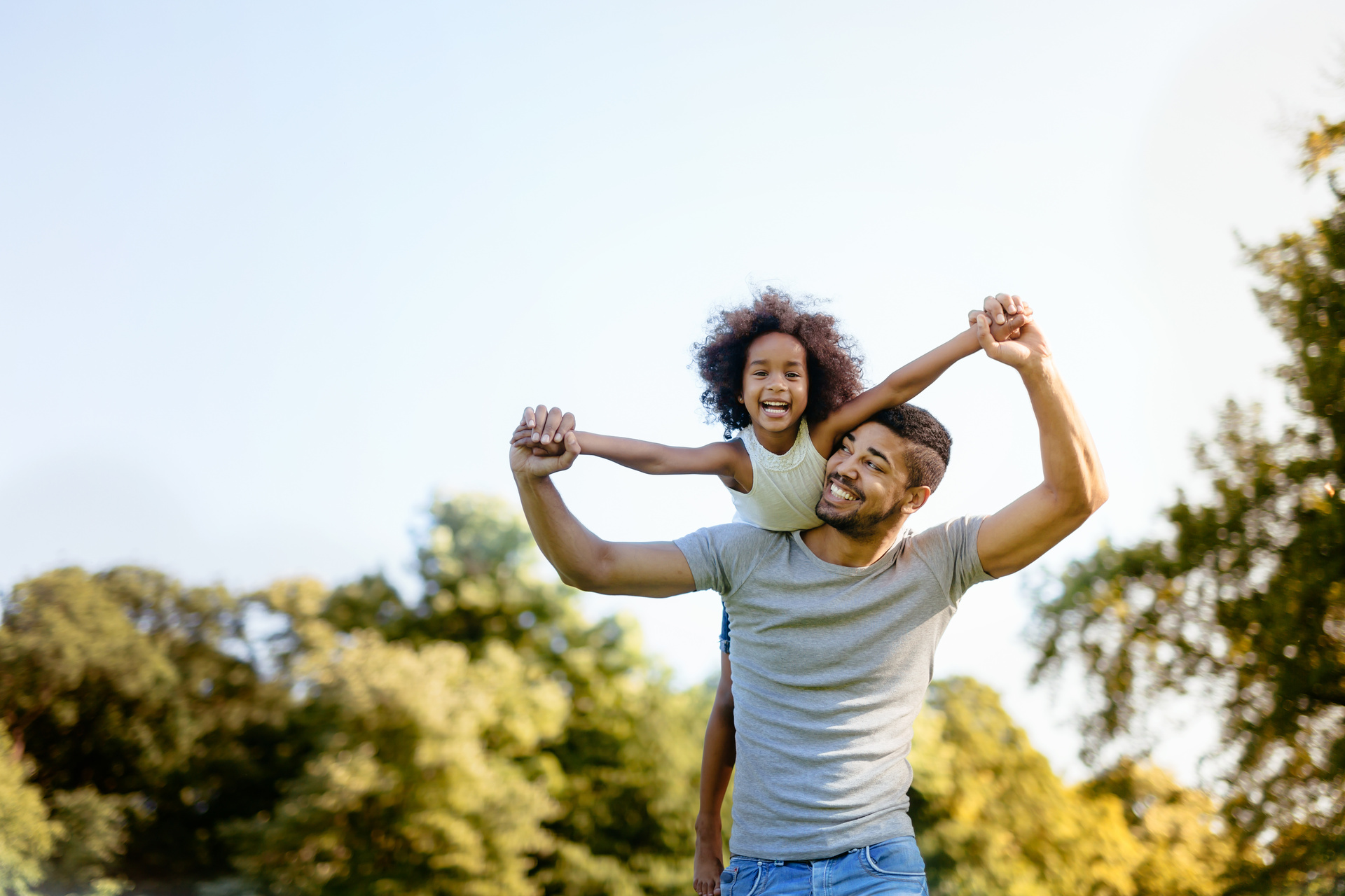 Father carrying daughter